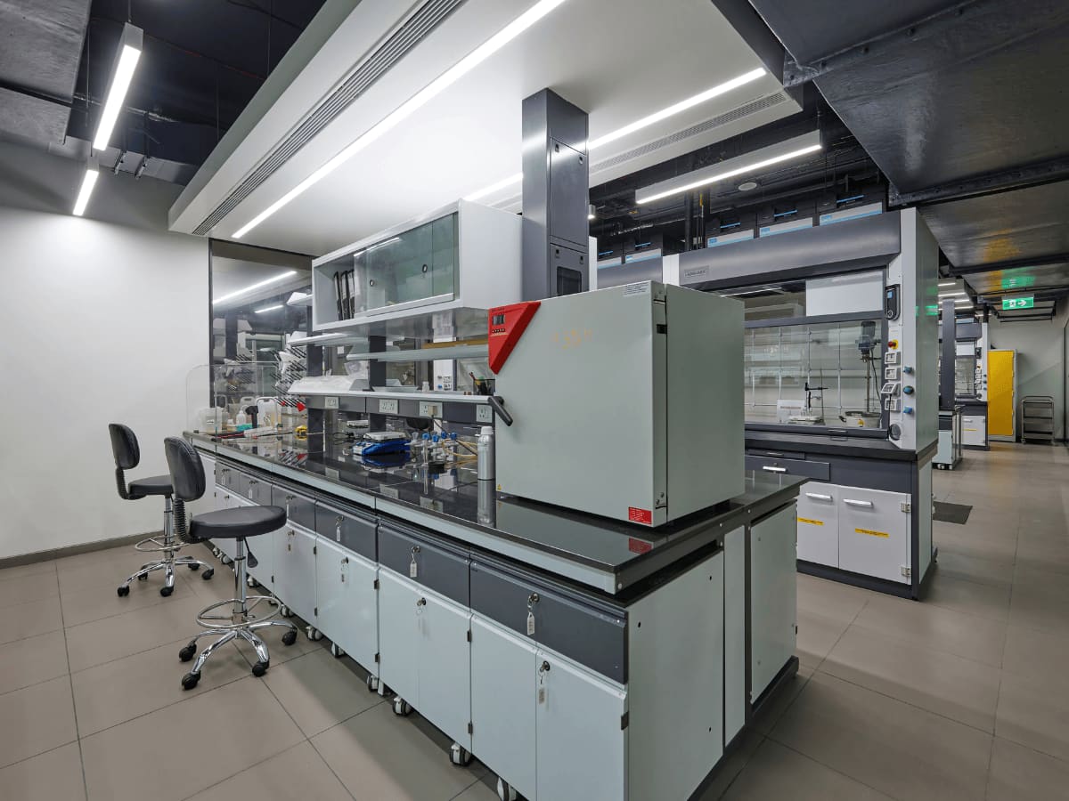 Analytical laboratory with fume hoods and instrumented benches
